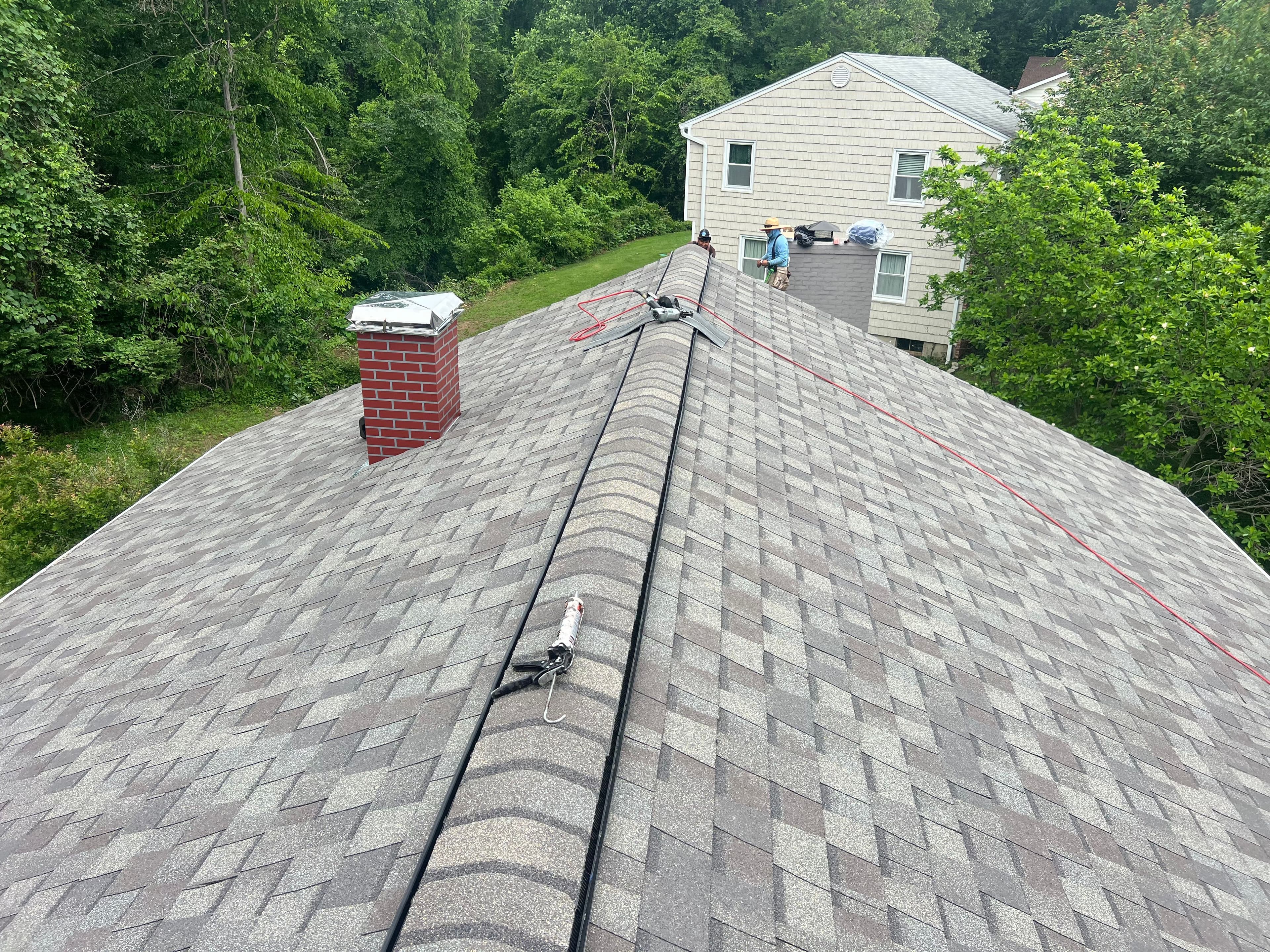 New asphalt shingle roof on a Woodlawn, MD 21207 home in Baltimore County — installed by Apper Construction, MHIC #05-146983