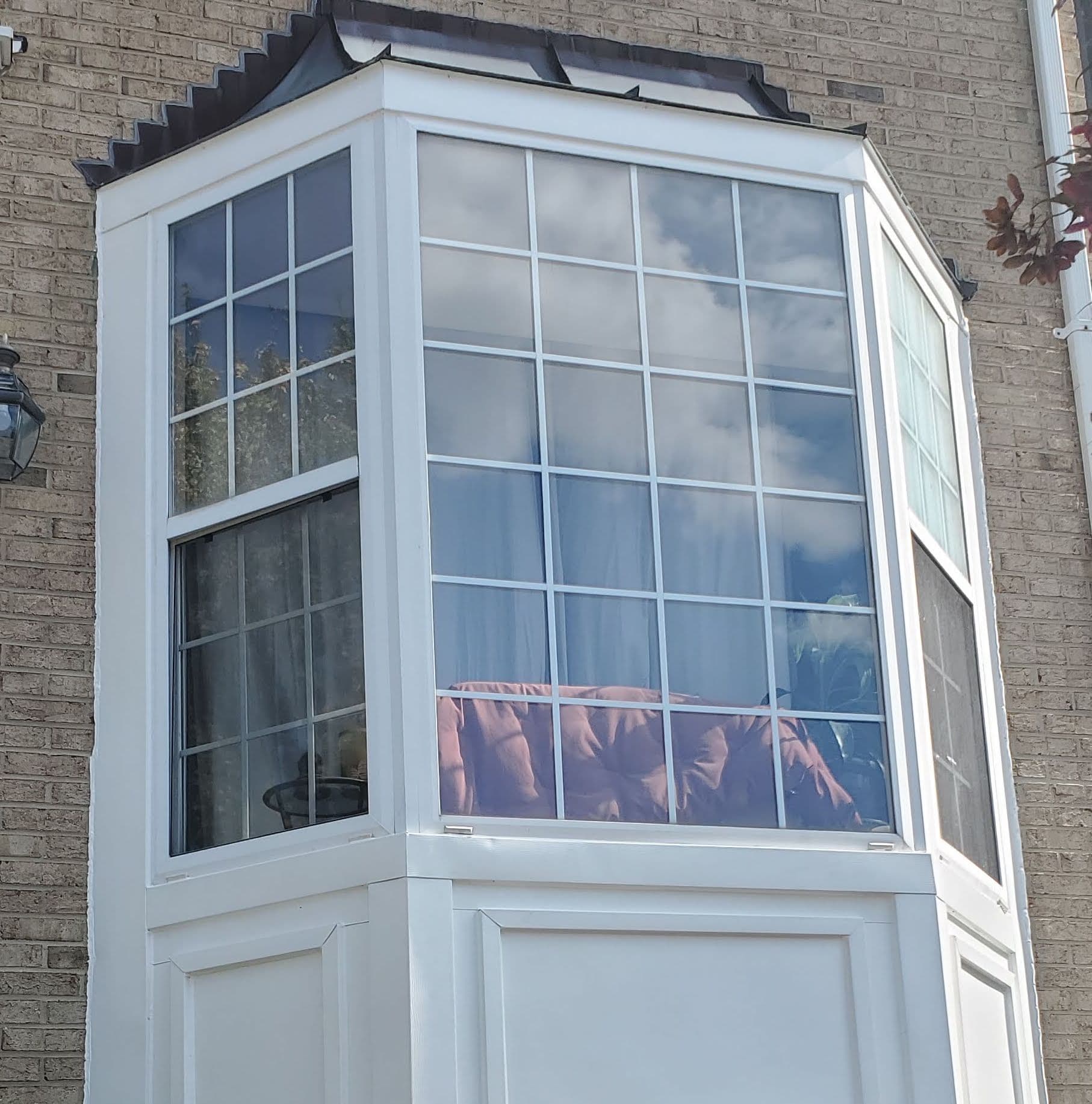Apper Construction installing energy-efficient replacement windows on a Maryland home