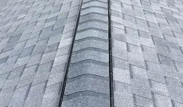 Asphalt shingle roof with continuous ridge vent installed by Apper Construction on a Severna Park Maryland home