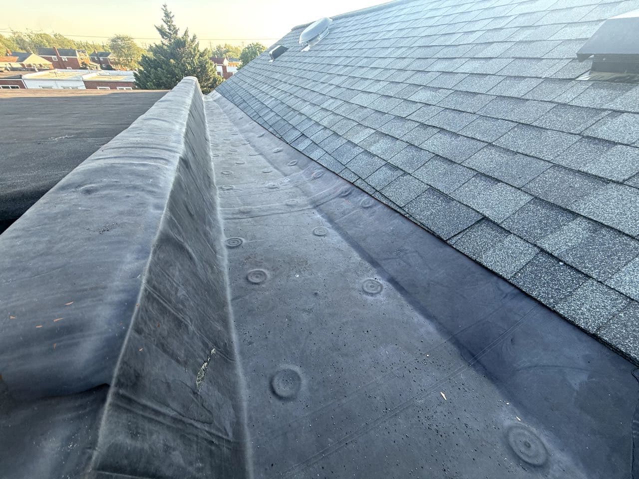 Close-up of a sealed EPDM rubber flat roof membrane installed in Maryland by Apper Construction