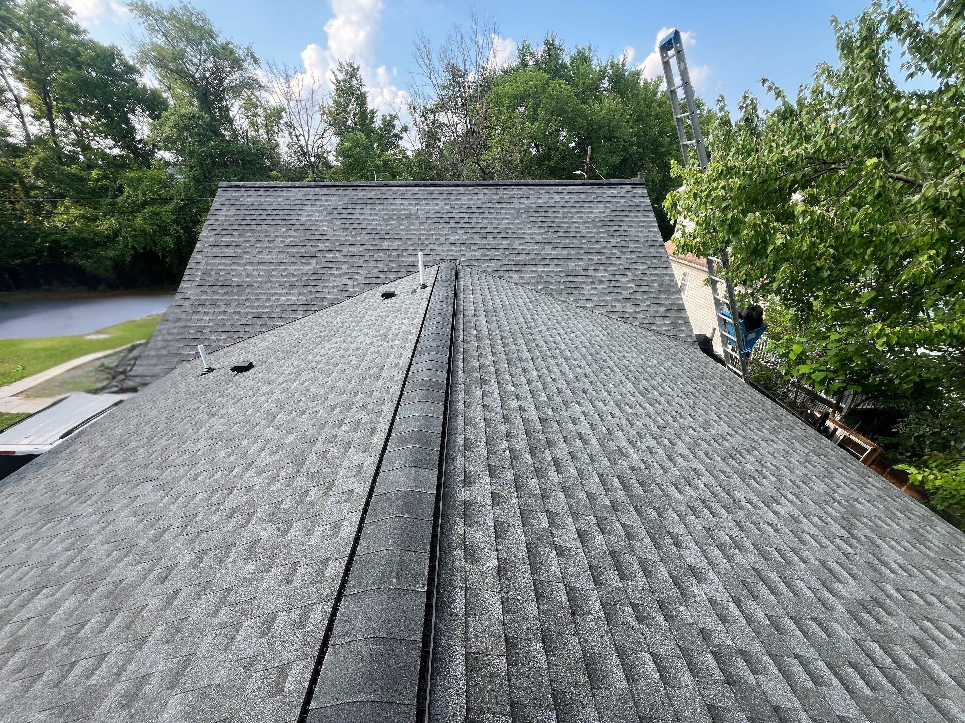 Replaced asphalt-shingle roof on a Maryland townhouse with shared walls