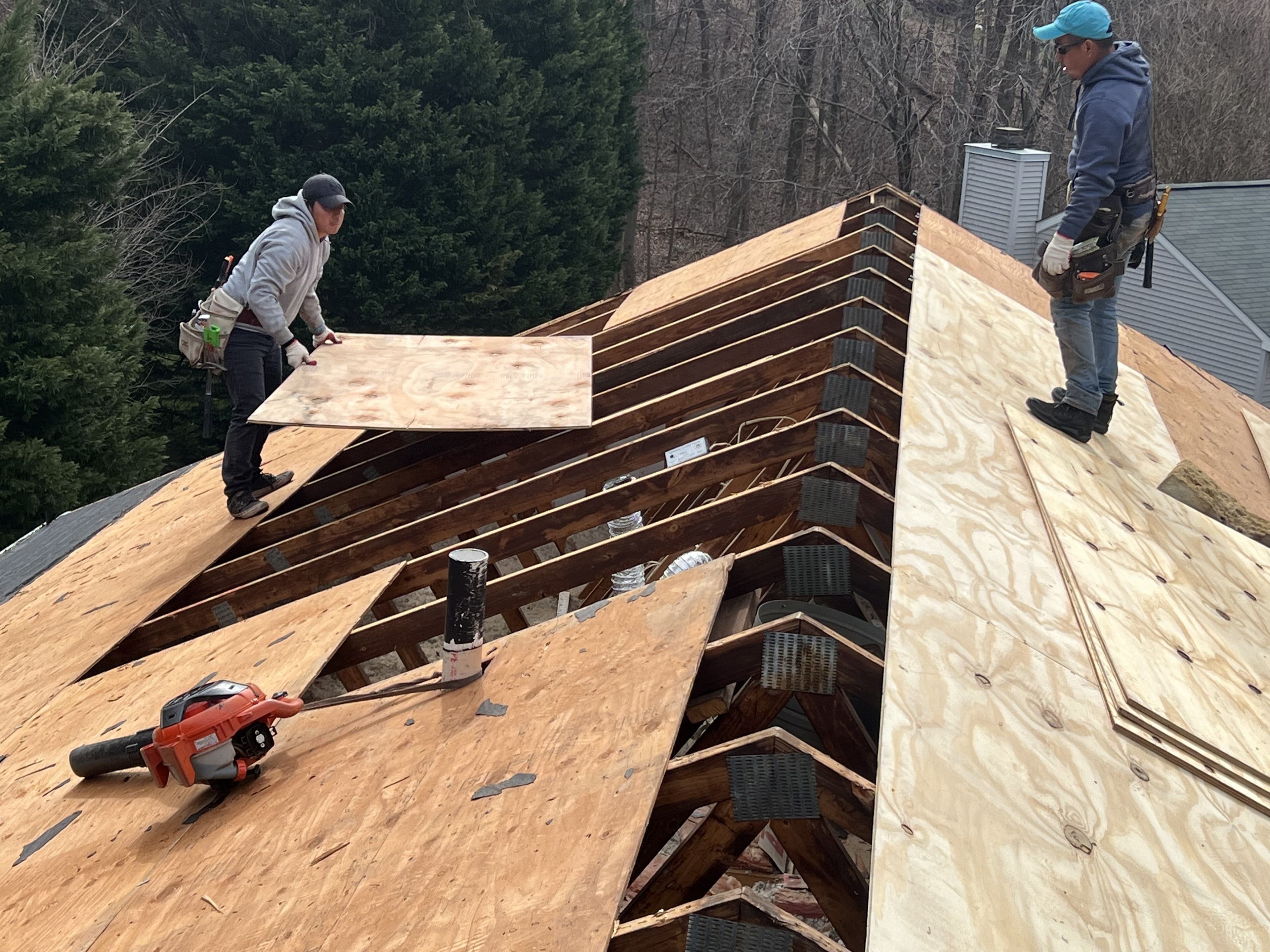 contractor inspecting a residential roof in Columbia